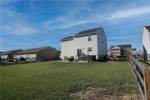 back of house featuring a yard and a patio