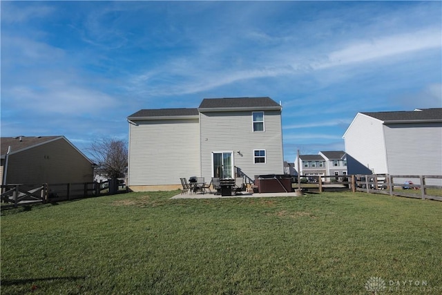 back of house featuring a yard and a patio