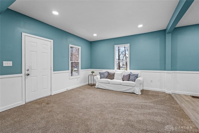 sitting room featuring carpet flooring