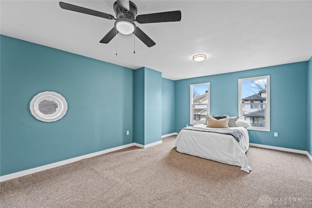 unfurnished bedroom featuring ceiling fan and carpet