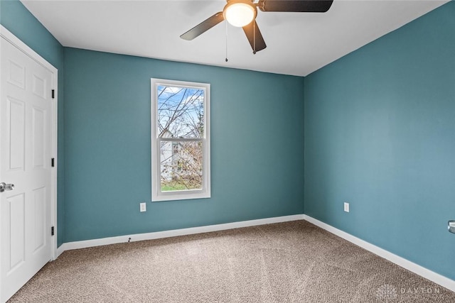 carpeted empty room with ceiling fan