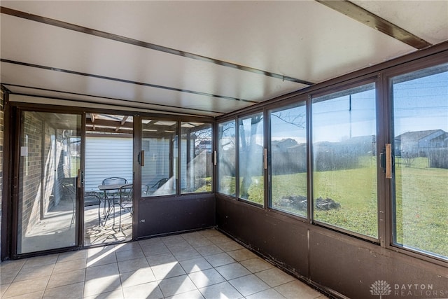 unfurnished sunroom featuring a mountain view