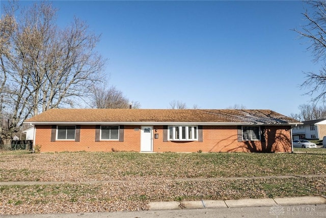 ranch-style home with a front yard