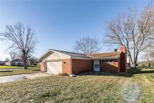 view of property exterior with a garage and a lawn