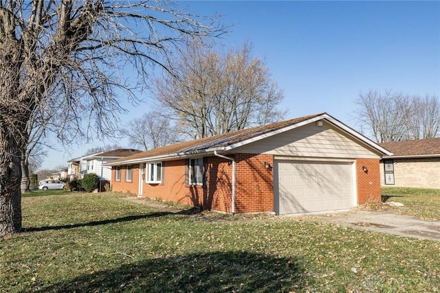 ranch-style home featuring a garage and a front yard