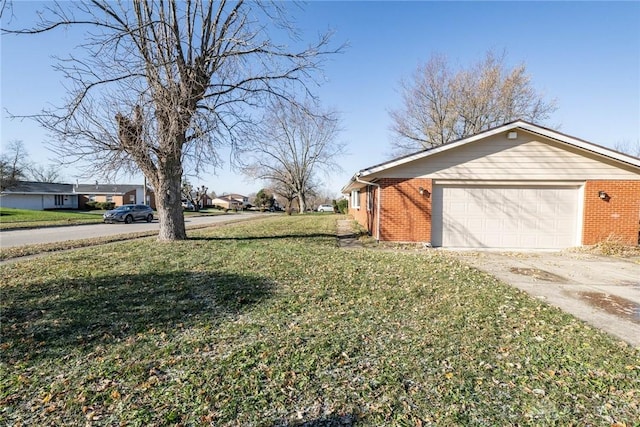 view of home's exterior with a lawn and a garage