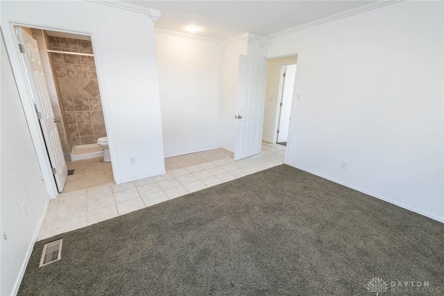 carpeted empty room featuring crown molding