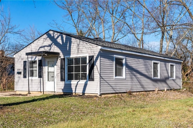 bungalow with a front lawn