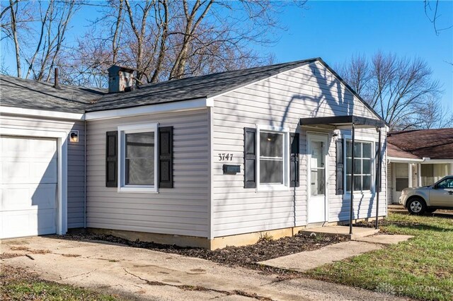 view of side of property featuring a garage