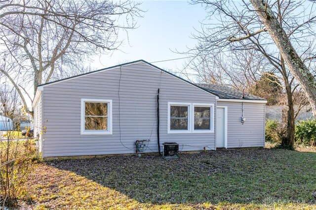 view of property exterior with a yard