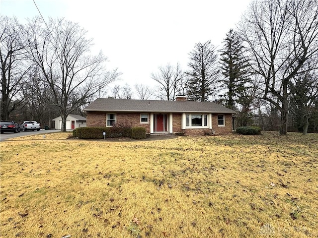 ranch-style house featuring a front lawn