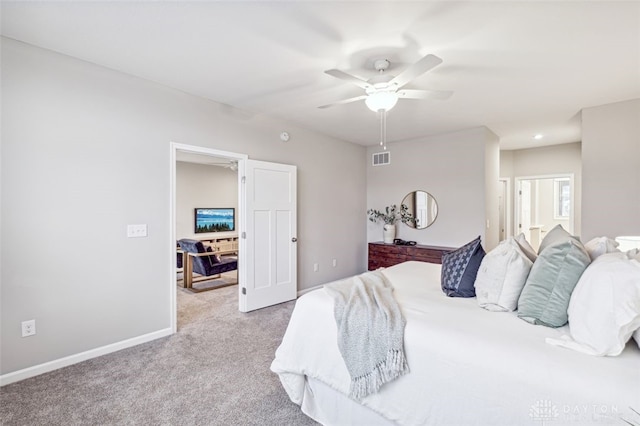 bedroom with ceiling fan and light carpet