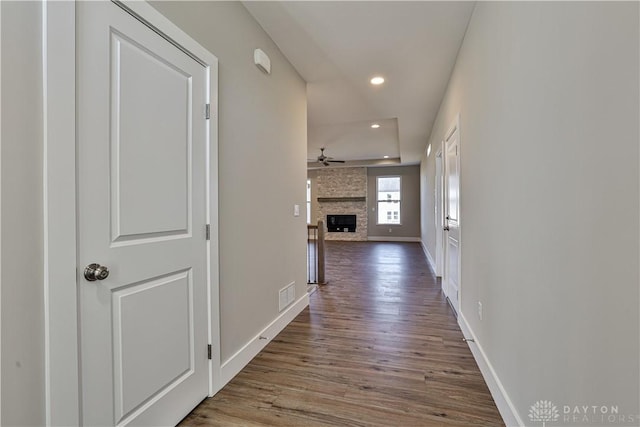 hallway with hardwood / wood-style floors