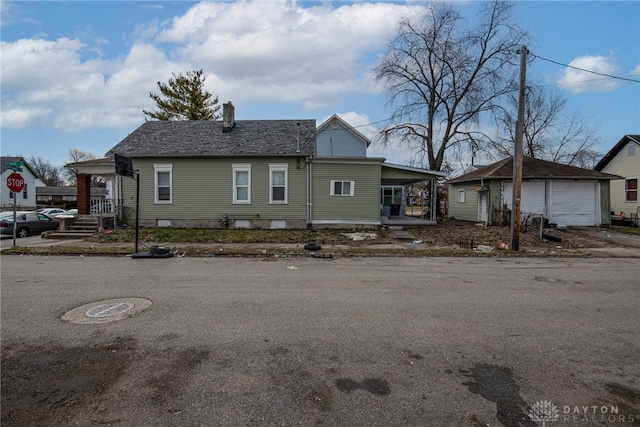 view of front of home featuring an outbuilding and a garage