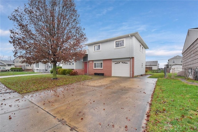 view of property with a garage and a front lawn