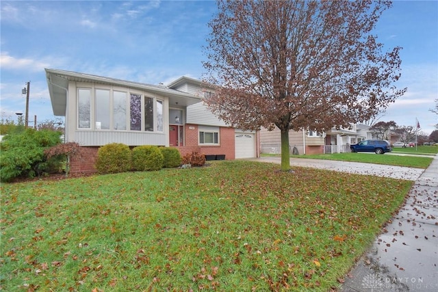 split level home featuring a garage and a front yard