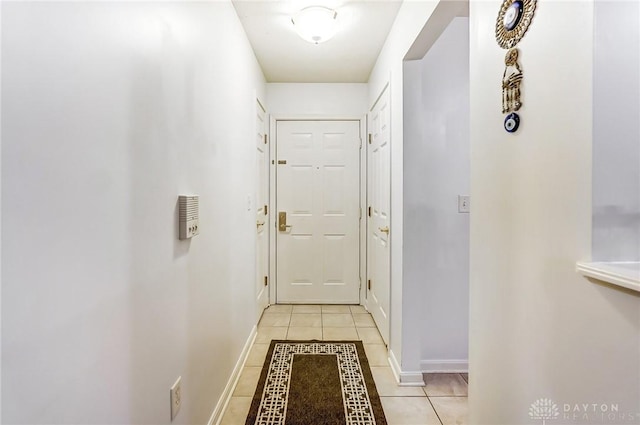 entryway with light tile patterned floors