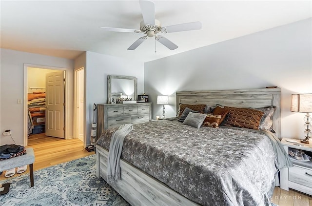 bedroom with a closet, ceiling fan, and light hardwood / wood-style flooring