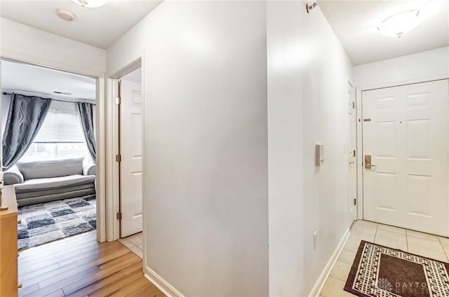 corridor featuring light hardwood / wood-style flooring