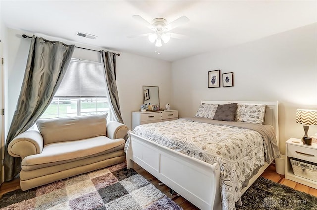 bedroom featuring dark hardwood / wood-style floors and ceiling fan