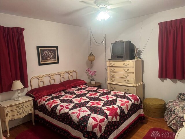 bedroom featuring ceiling fan and hardwood / wood-style floors