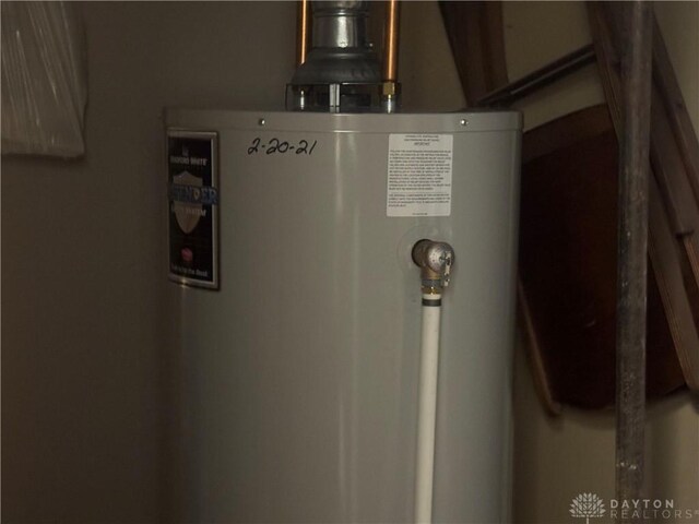 utility room with gas water heater