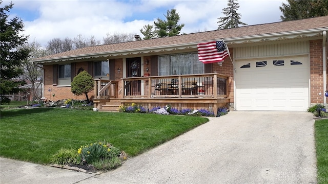 ranch-style home with a garage, covered porch, and a front lawn