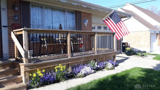 wooden terrace featuring a porch