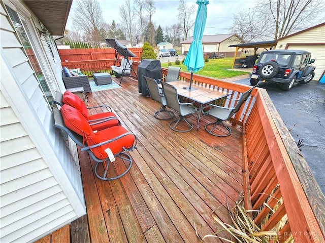 wooden terrace with outdoor lounge area