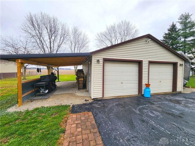 garage featuring a carport