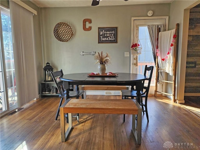 dining area with wood-type flooring