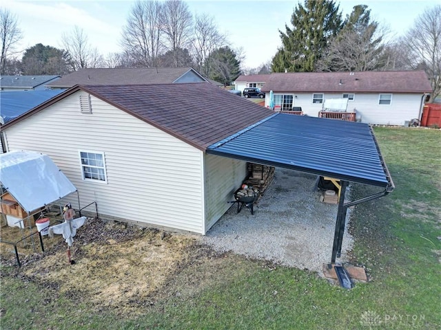 view of side of property with a yard