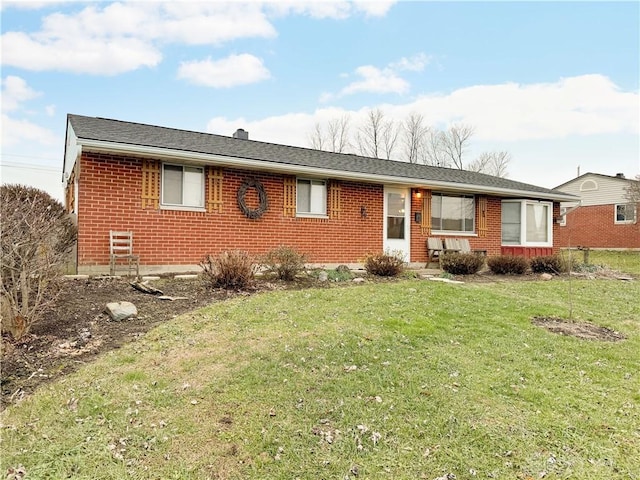 single story home with a front yard