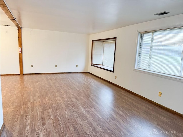 empty room featuring hardwood / wood-style flooring