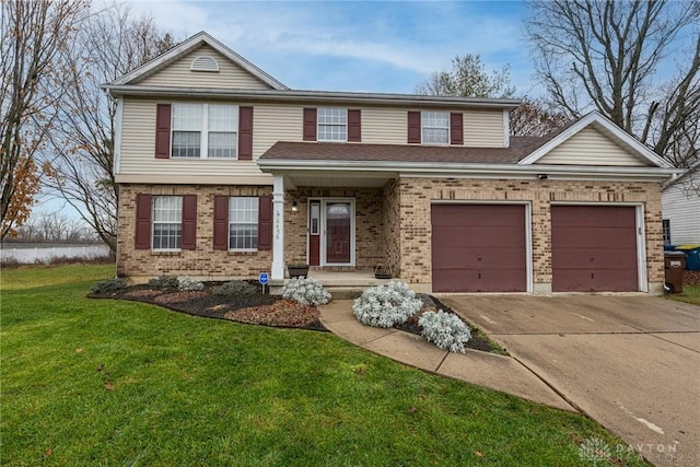 traditional-style home with an attached garage, brick siding, driveway, and a front lawn