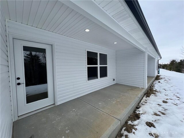 view of snow covered patio