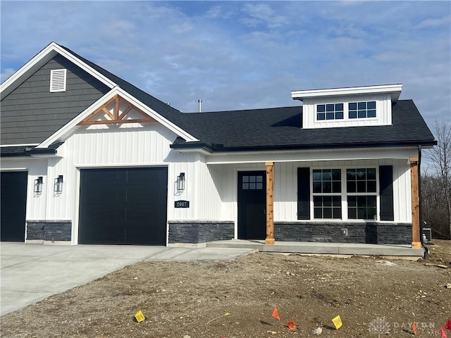 view of front of property with a garage and covered porch