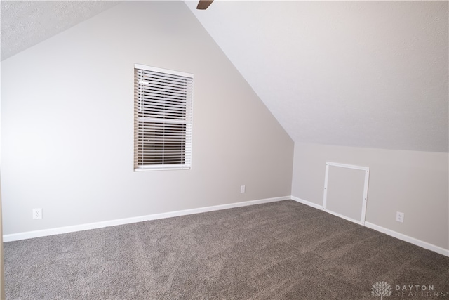 bonus room featuring ceiling fan, carpet floors, and vaulted ceiling