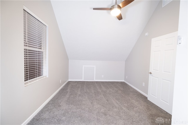 additional living space featuring carpet flooring, ceiling fan, and vaulted ceiling