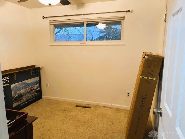 living area with light colored carpet