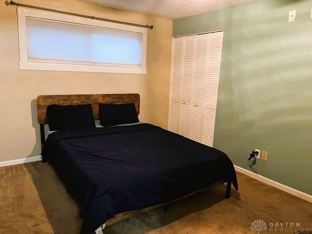 carpeted bedroom featuring a closet