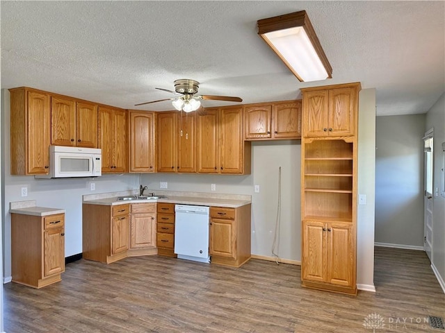 kitchen featuring dark hardwood / wood-style flooring, white appliances, a textured ceiling, and ceiling fan