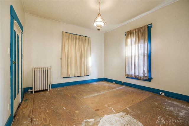 unfurnished room with radiator