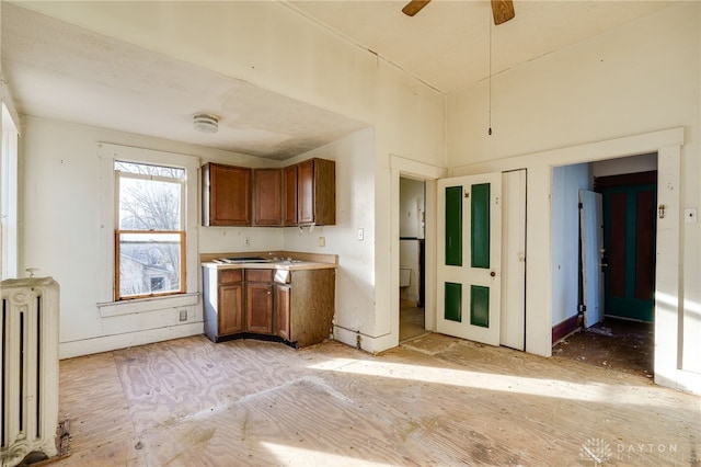 kitchen featuring radiator and ceiling fan