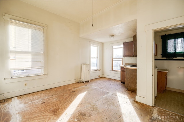 kitchen featuring radiator heating unit