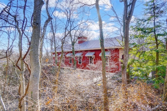 view of property exterior featuring a chimney