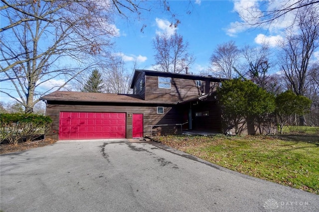 traditional home with driveway and a garage