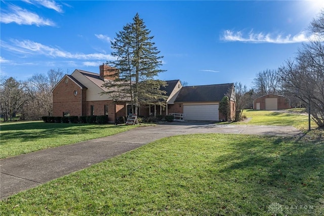 view of front of house with a garage and a front yard