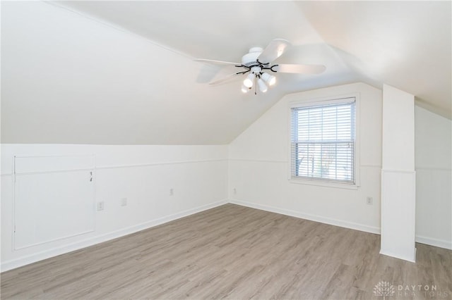 bonus room featuring light hardwood / wood-style floors, ceiling fan, and lofted ceiling