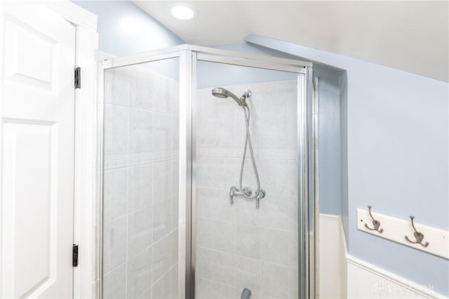 bathroom with vaulted ceiling and an enclosed shower